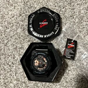 G-shock by Casio black with gold accents watch